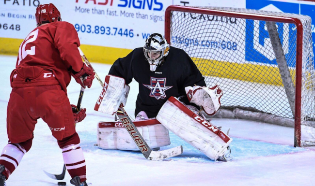 A picture of Thomas Hodges getting ready to block a shot from an opponent. Photo credit: Dianne Webster