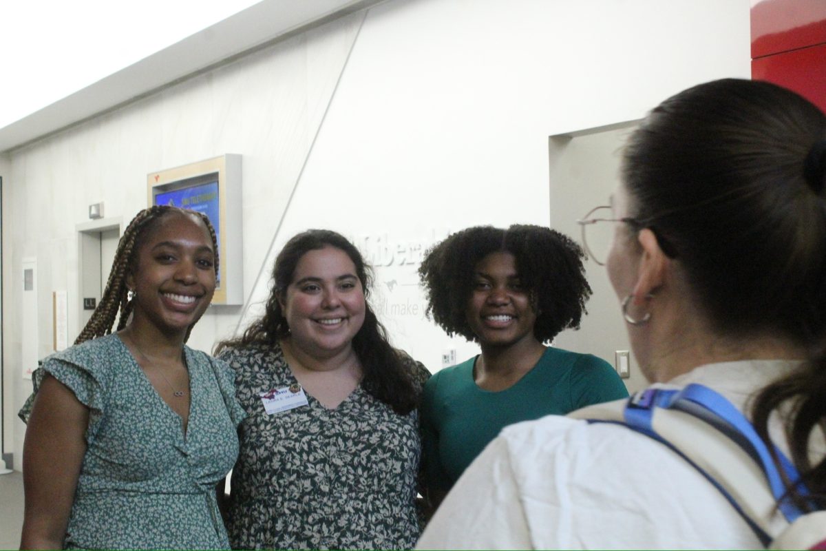 Symposium attendees smile for the camera.