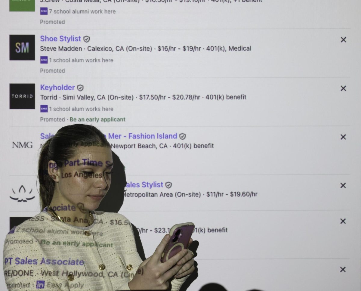 A college student endlessly scrolls on LinkedIn looking at possible jobs.